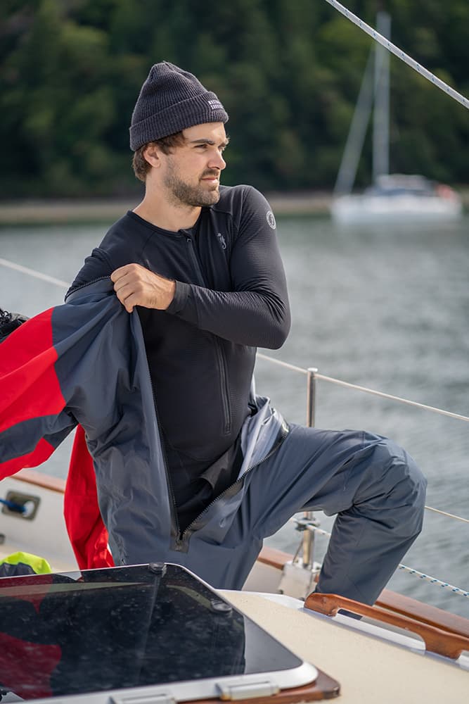 Putting on a drysuit on boat